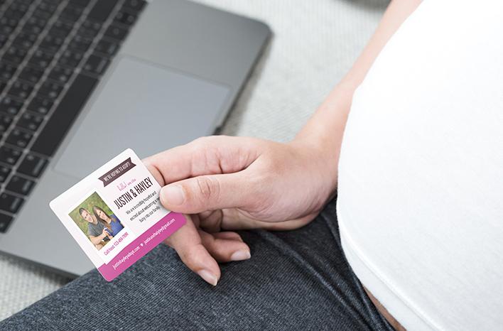 Pregnant Woman holding business card